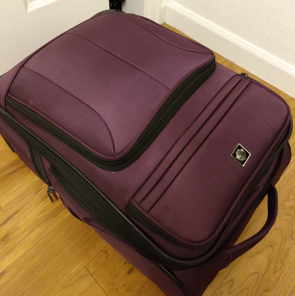 Suitcase for sale. Durable, storage and has wheels